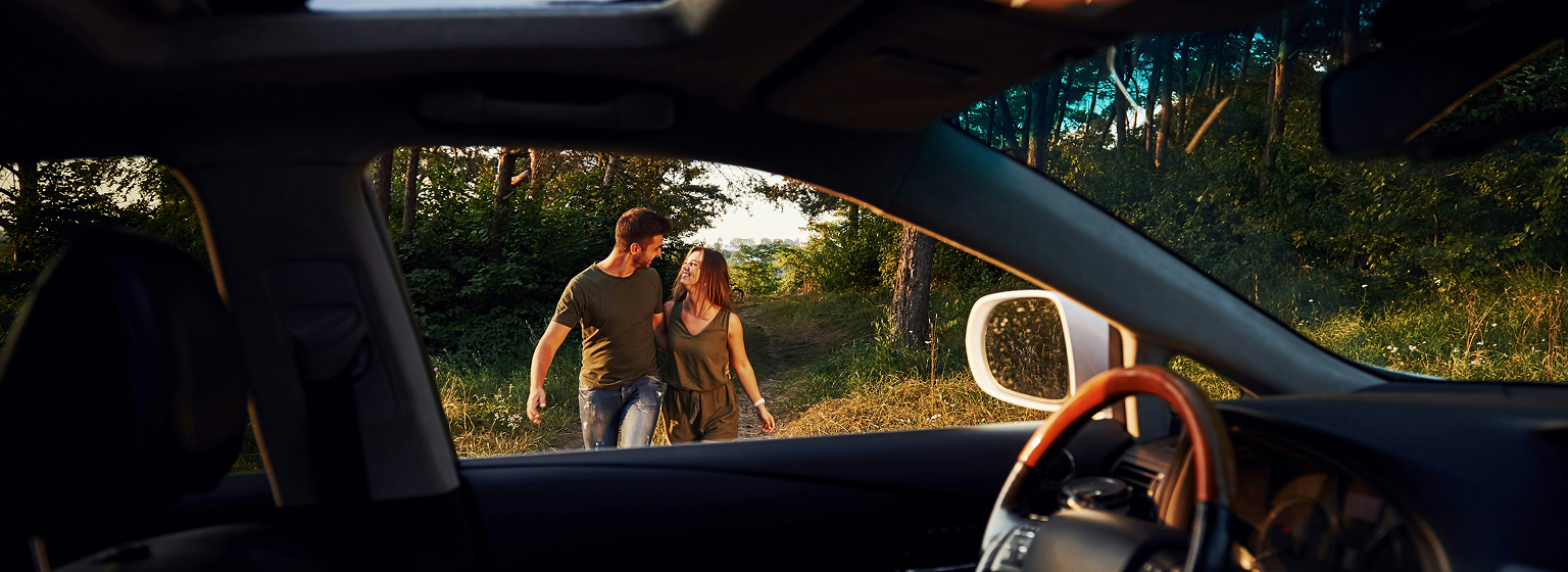 A couple walking toward their car